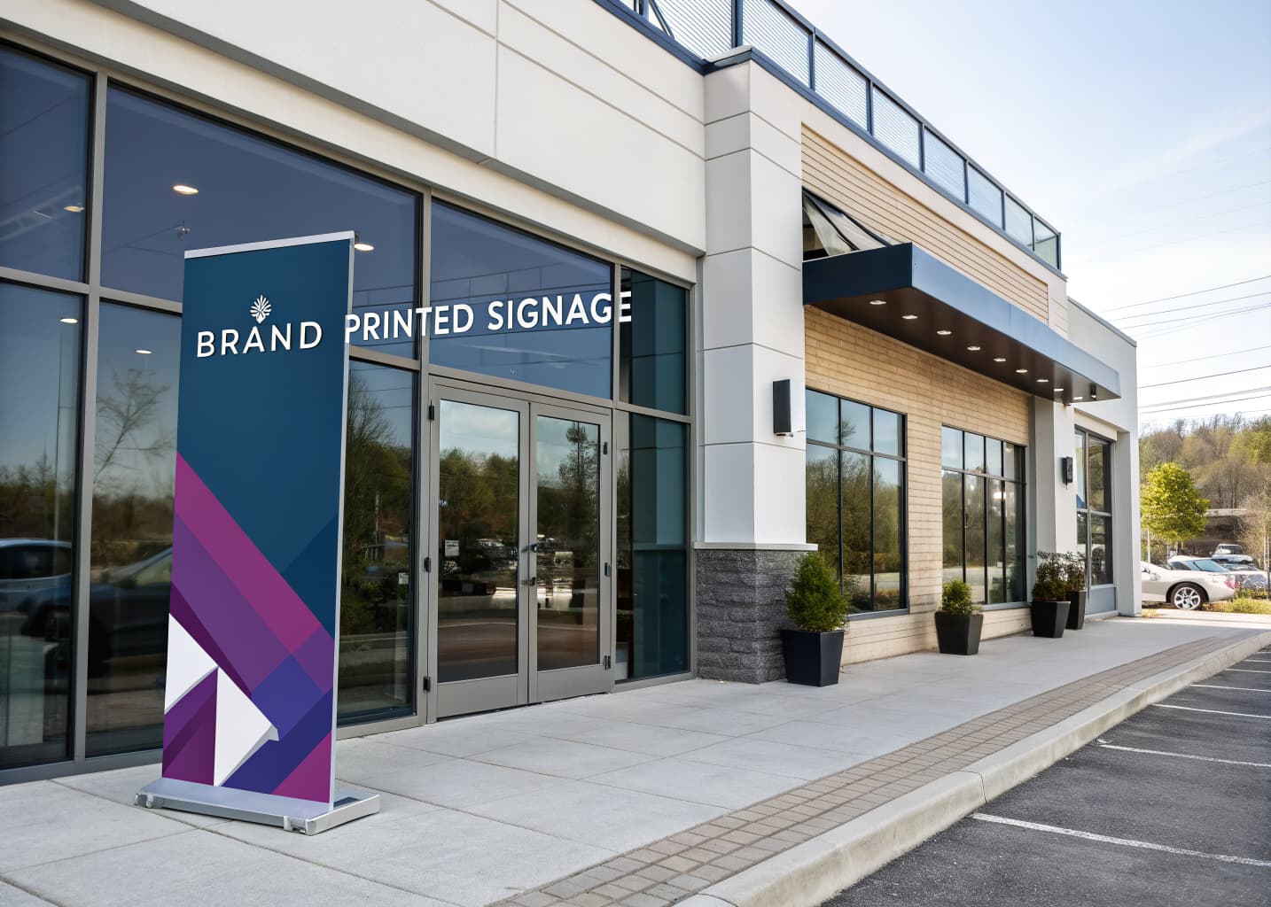 Modern storefront with a branded retractable banner and window signage at the entrance