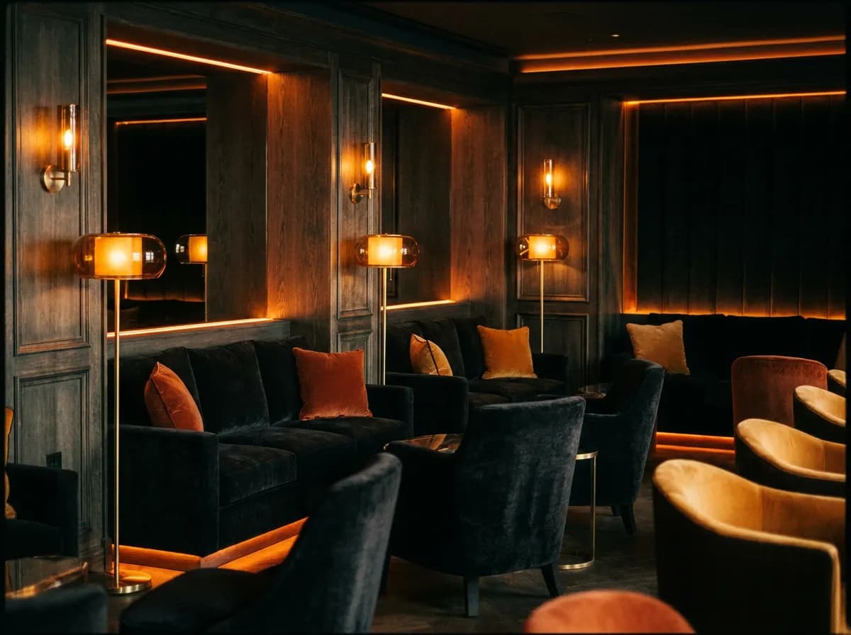Upscale gentlemen club lounge with velvet seating and amber lighting